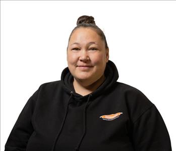 A SERVPRO® employee in front of a white background