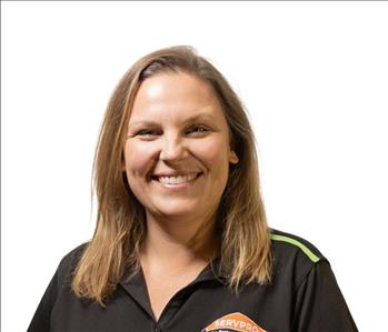 A SERVPRO® employee in front of a white background