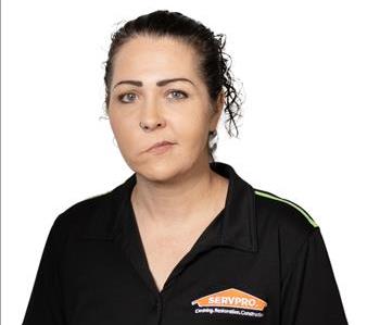 A SERVPRO® employee in front of a white background